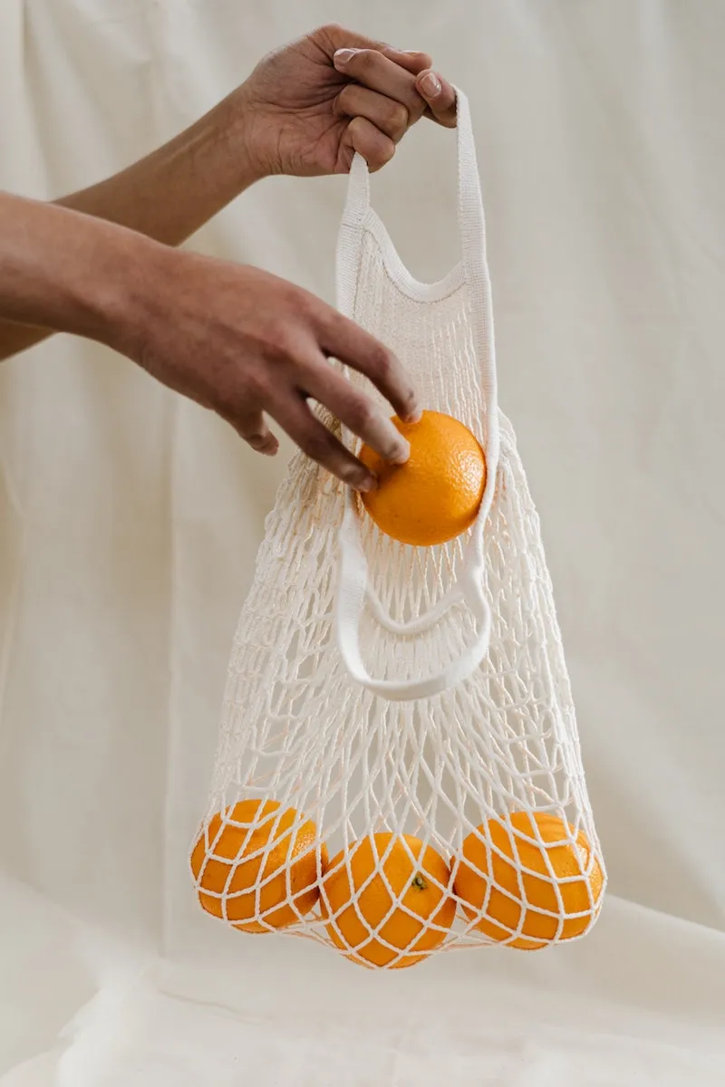 omemade fruit fly trap shopping bag with oranges