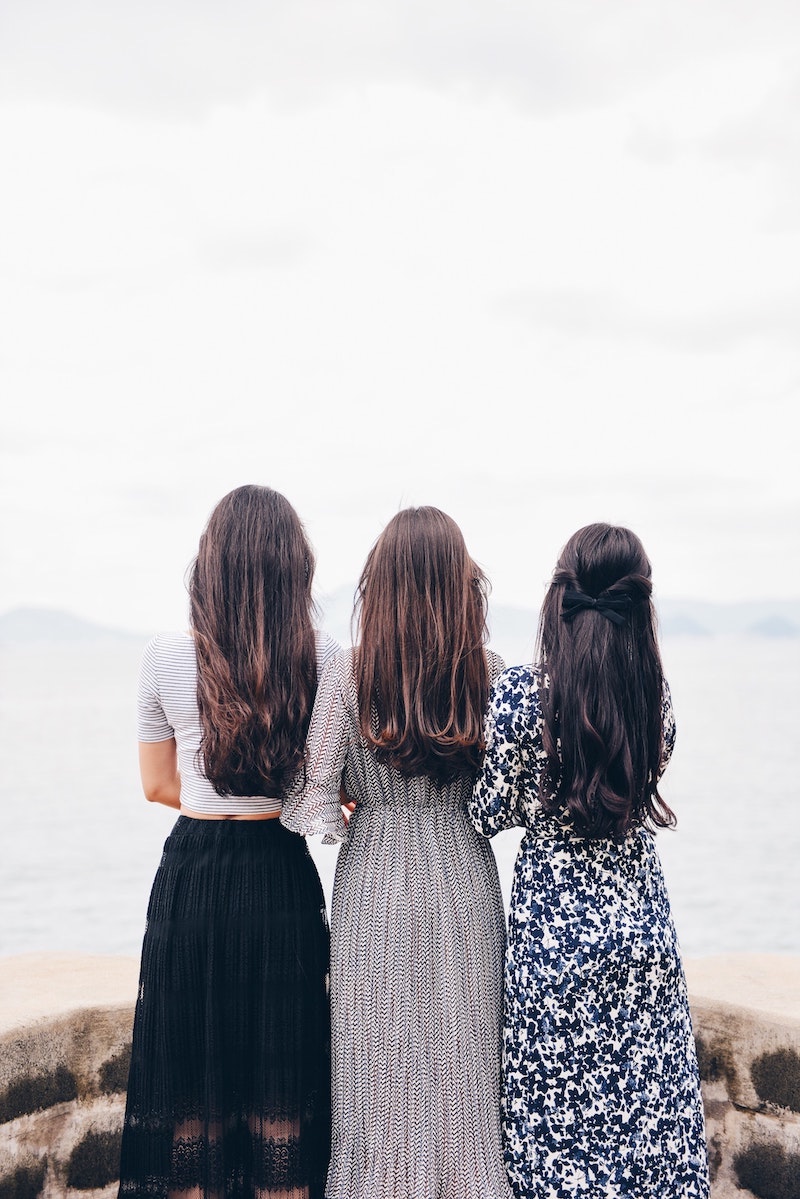 three women with thick hair