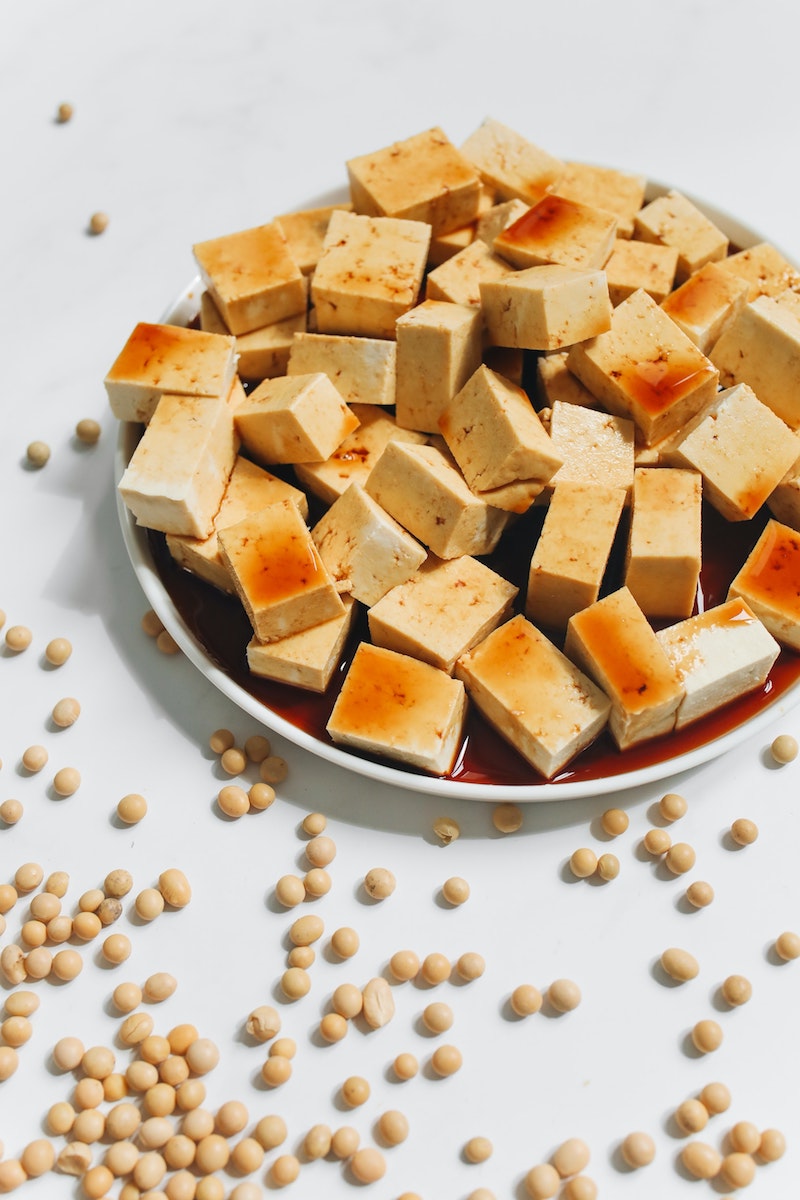 tofu and soya beans on white background