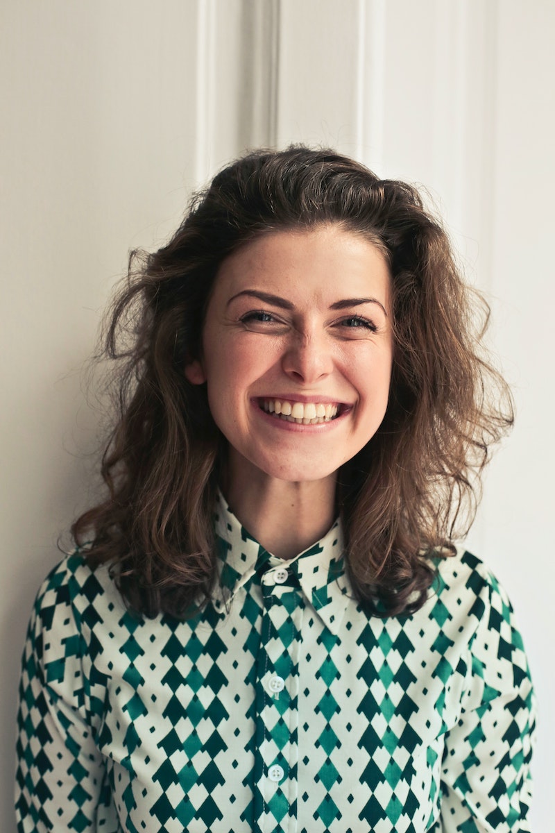 woman with brown hair smiling