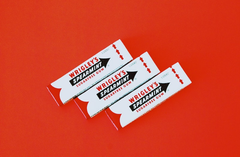 acid reflux wrigley sugar free gum on red background