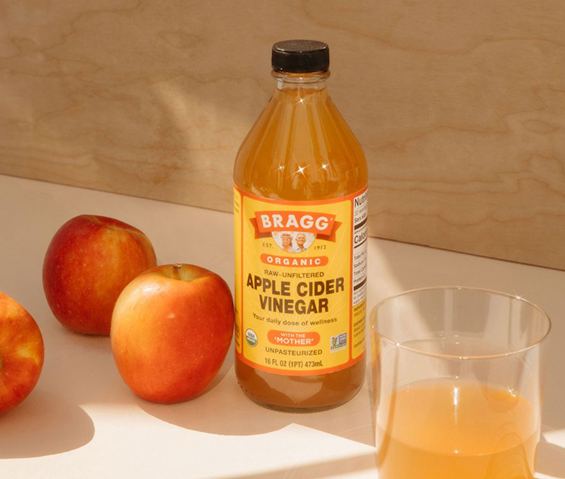 apple cider vinegar bottle with apples