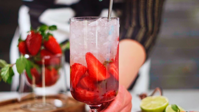 how to make strawberry mojito mixing with metal spoon cocktail