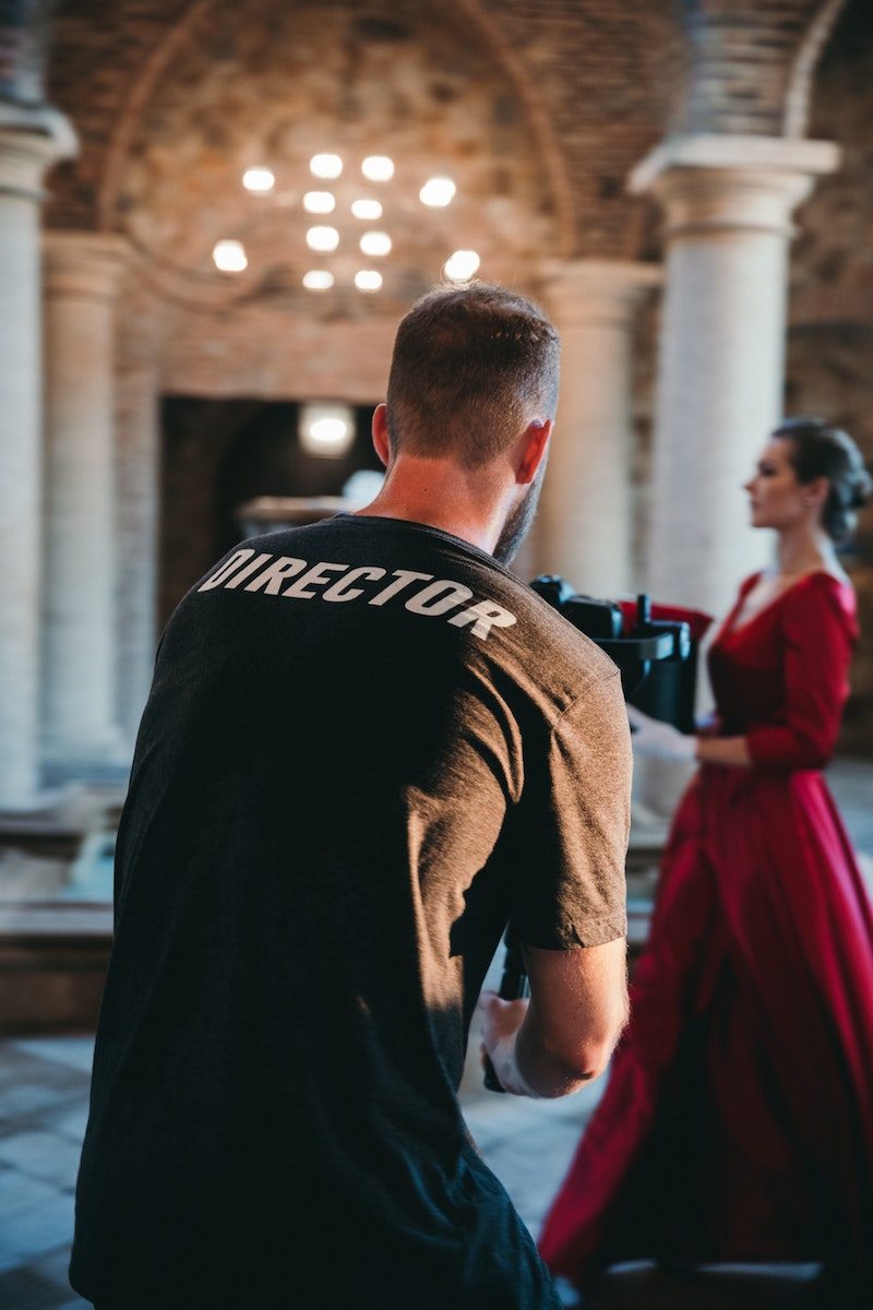 man with black tshirt that says director