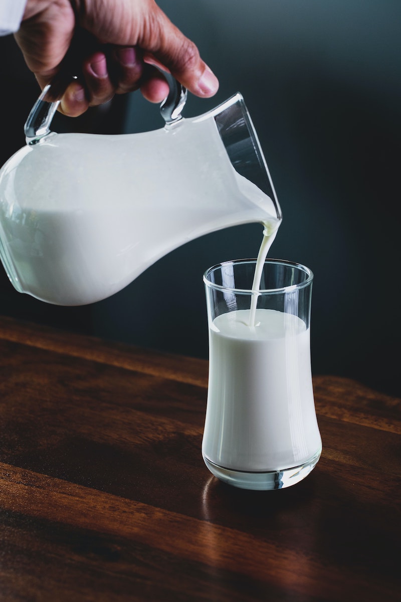 milk being poured in a glass