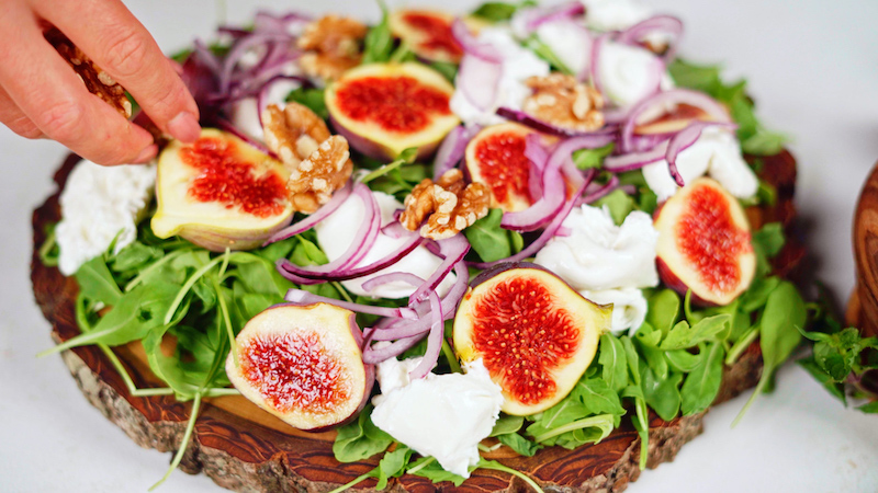 salad with arugula figs burrata onion and walnuts