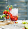 strawberry mojito recipe strawberry mohito in a glass with strawberry garnish