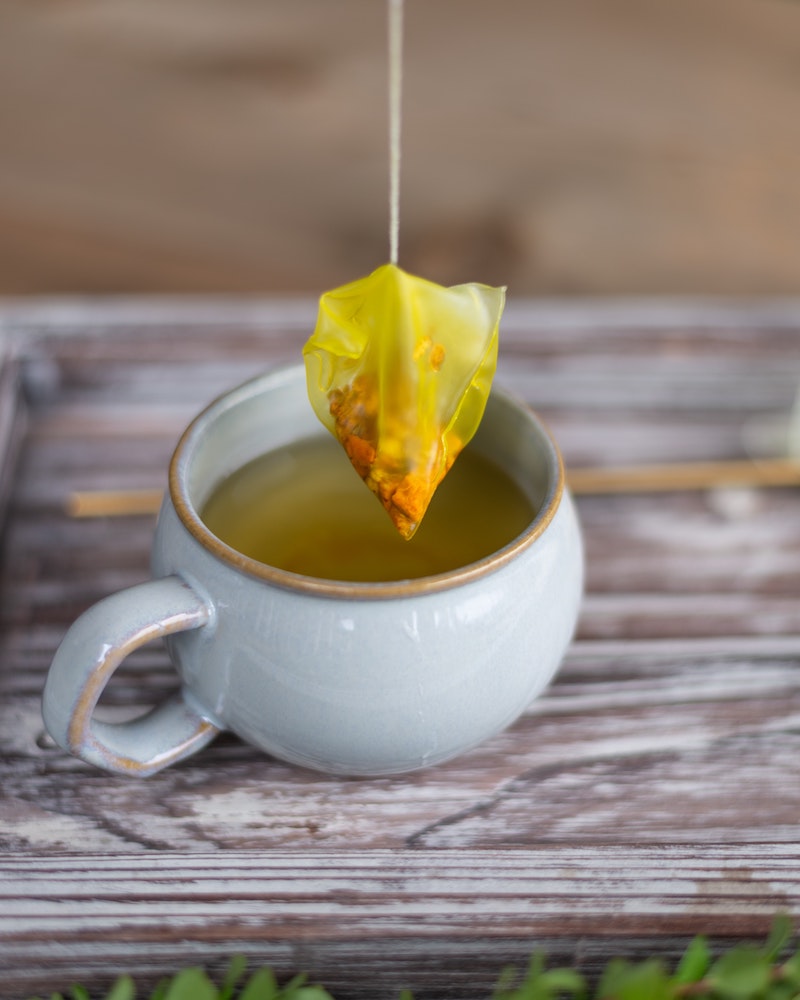 turmuric benefits turmuric tea bag out of cup of tea