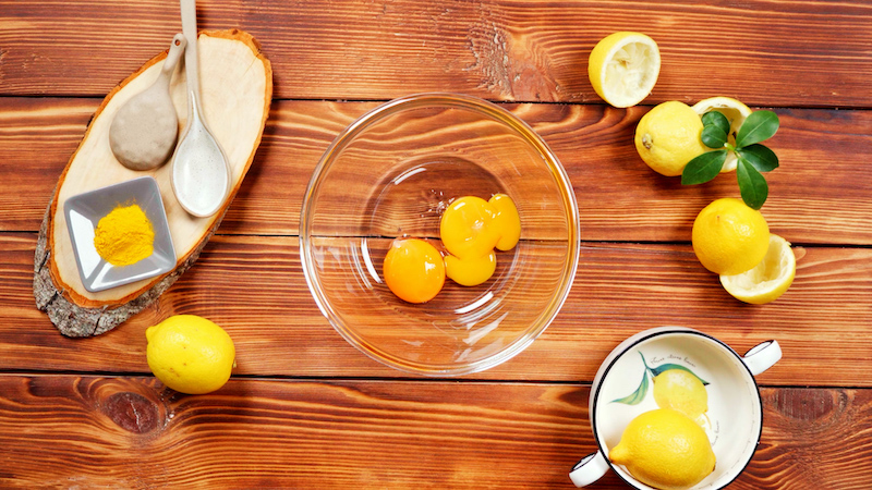 two egg yolks in a transparent glass bowl