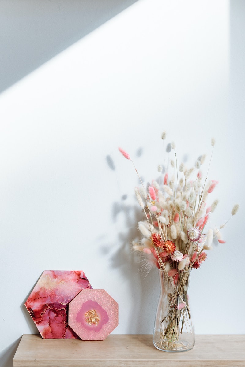 vase next to pink resin art