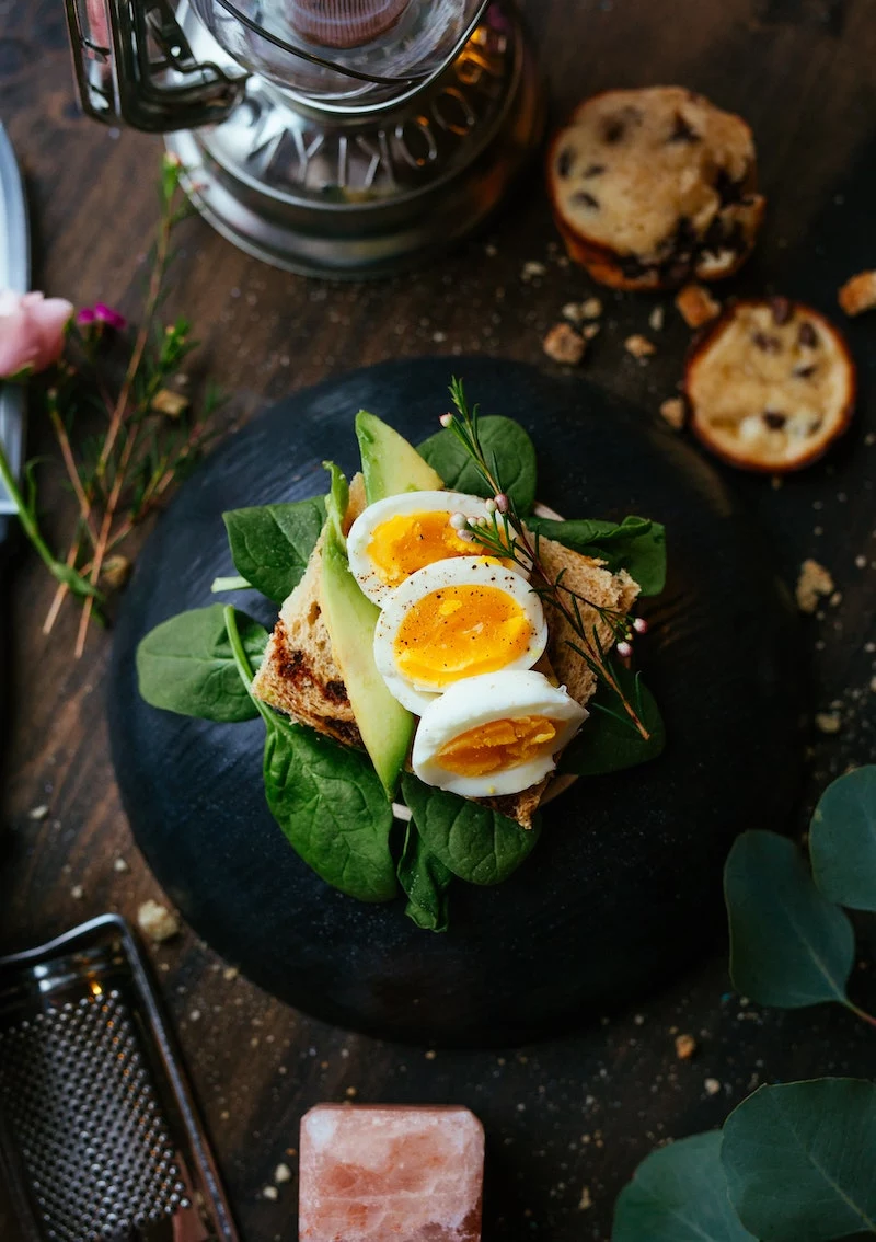 vitamin a foods soft boiled eggs on an avocado toast