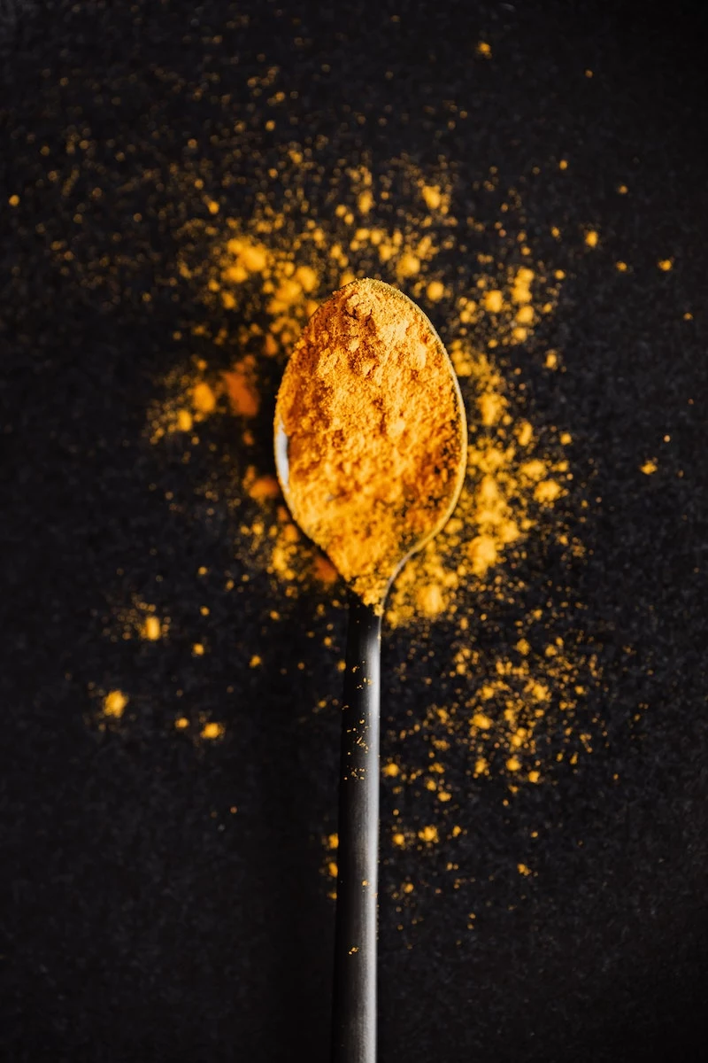 what benefits does turmeric have turmeric powder on a spoon