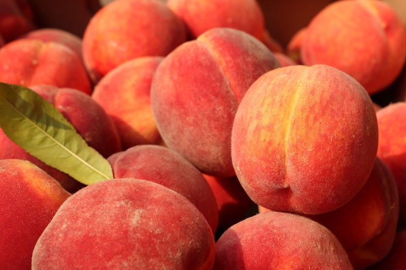 beach snacks fruit peaches in a bunch