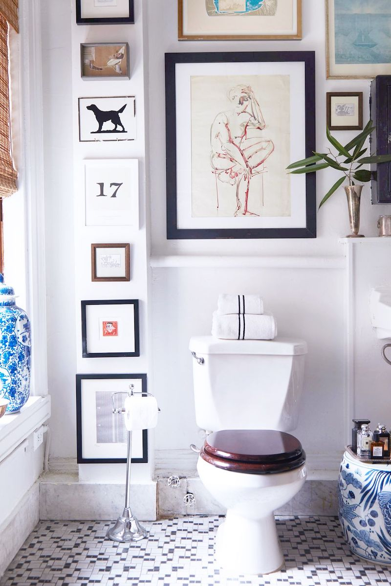crispy white bathroom paint with paintings on wall