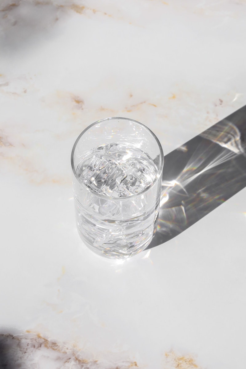 cup of water on a marble counter
