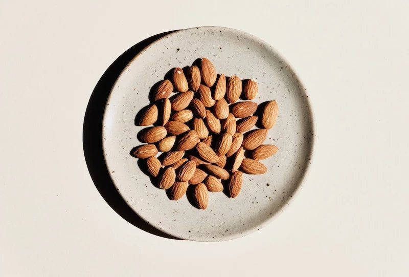 foods for eyesight almonds on a circular plate
