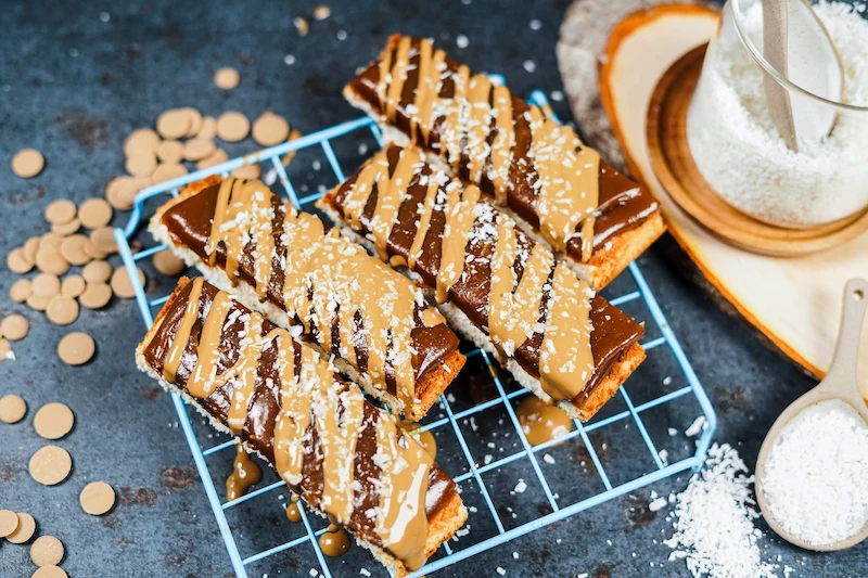 four homemade twix bars on a rack