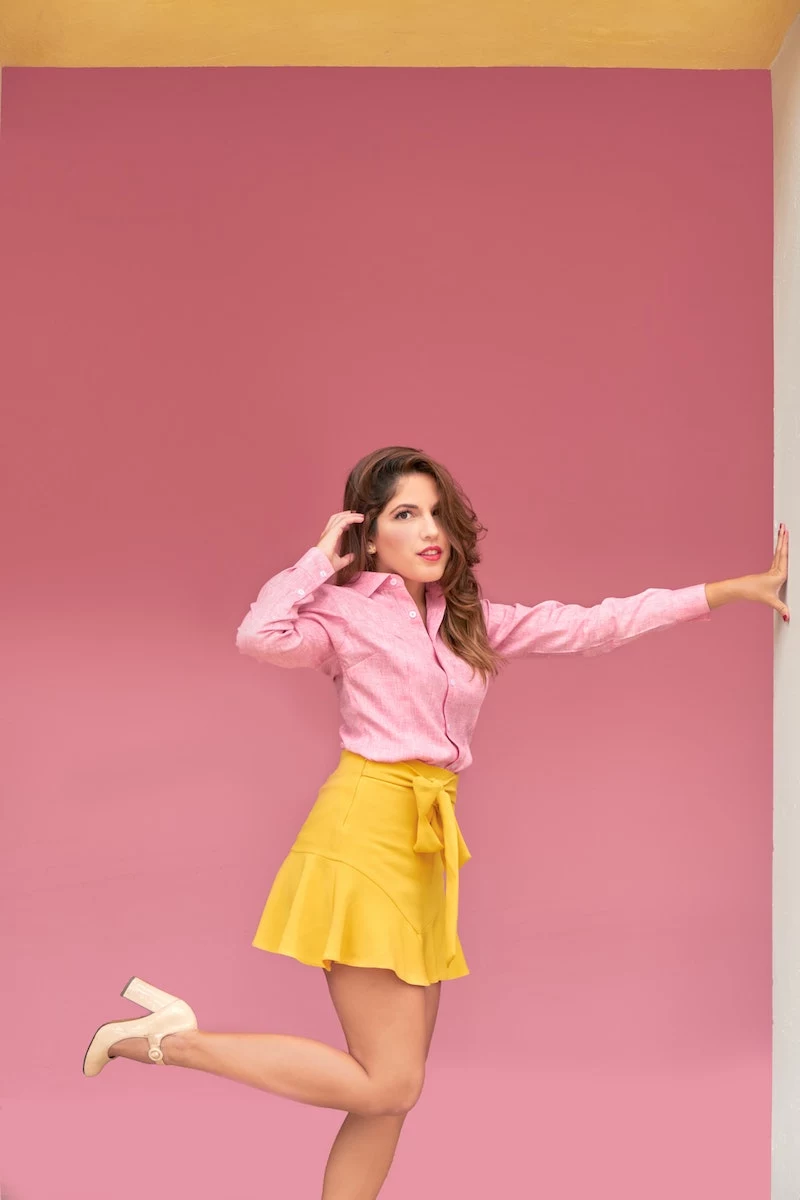 girl with pink shirt and yellow skirt