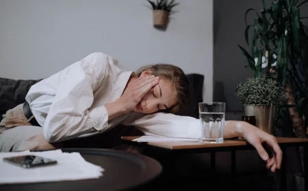headache relief woman laying on her side with eyed closed