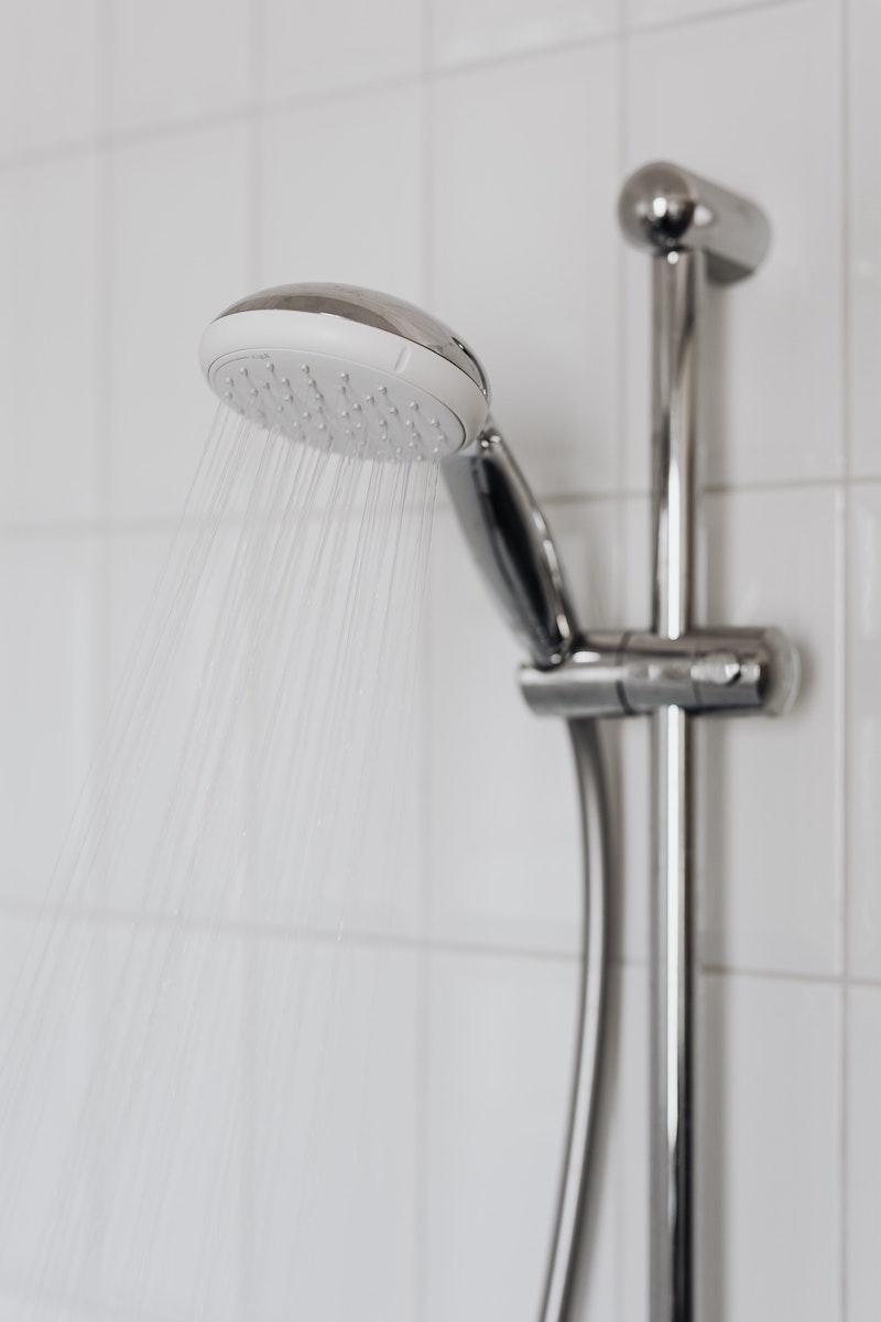 how to clean a shower shower head pouring water