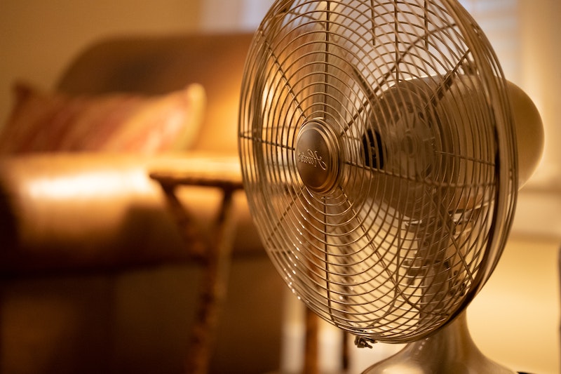 keep cool during the summer fan in golden light