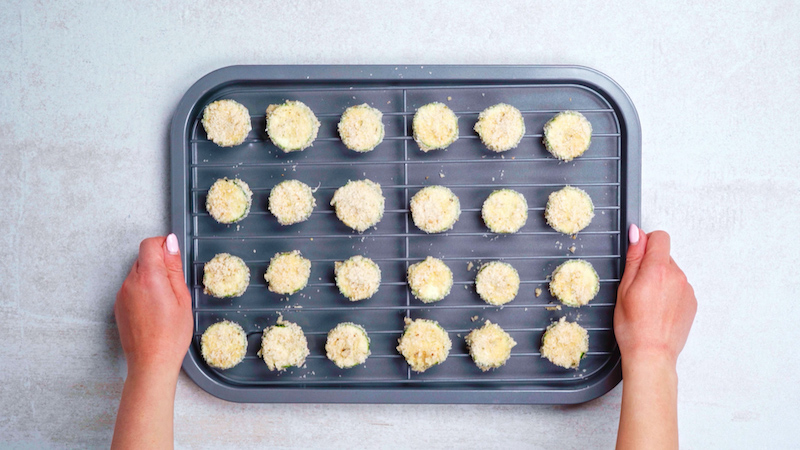 keto zucchini bites on a cooking rack on a baking pan