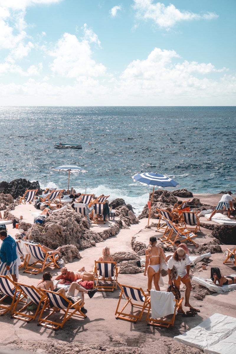 people tanning on the beach coast
