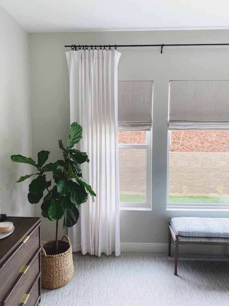 perfectly fitting white drapes above window