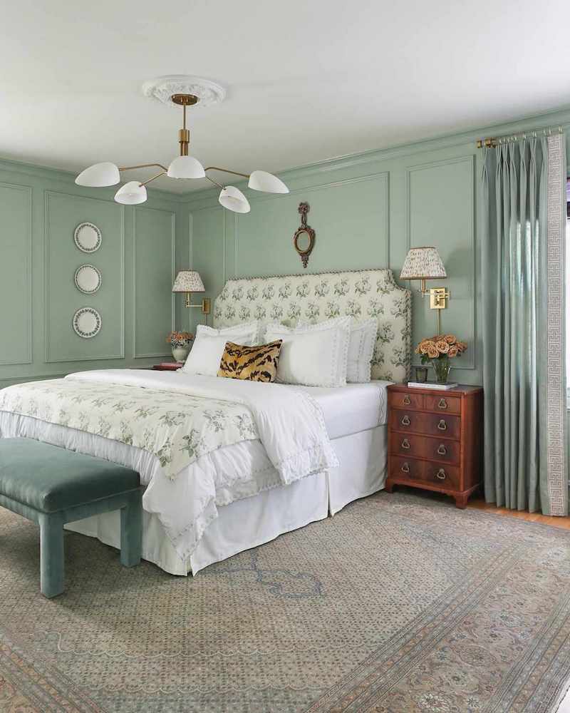 sage green bedroom with big bed