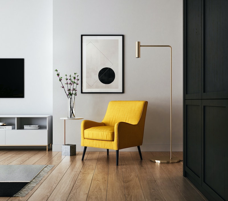 yellow chair in middle of the room