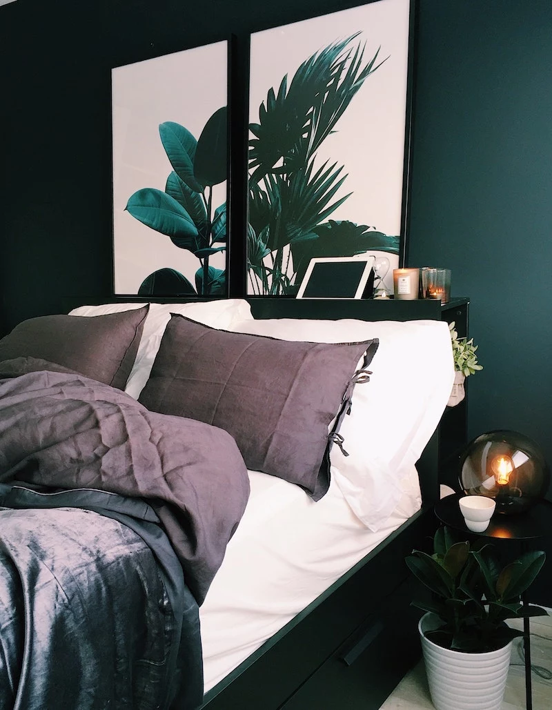 bedroom with purple dark bed sheets