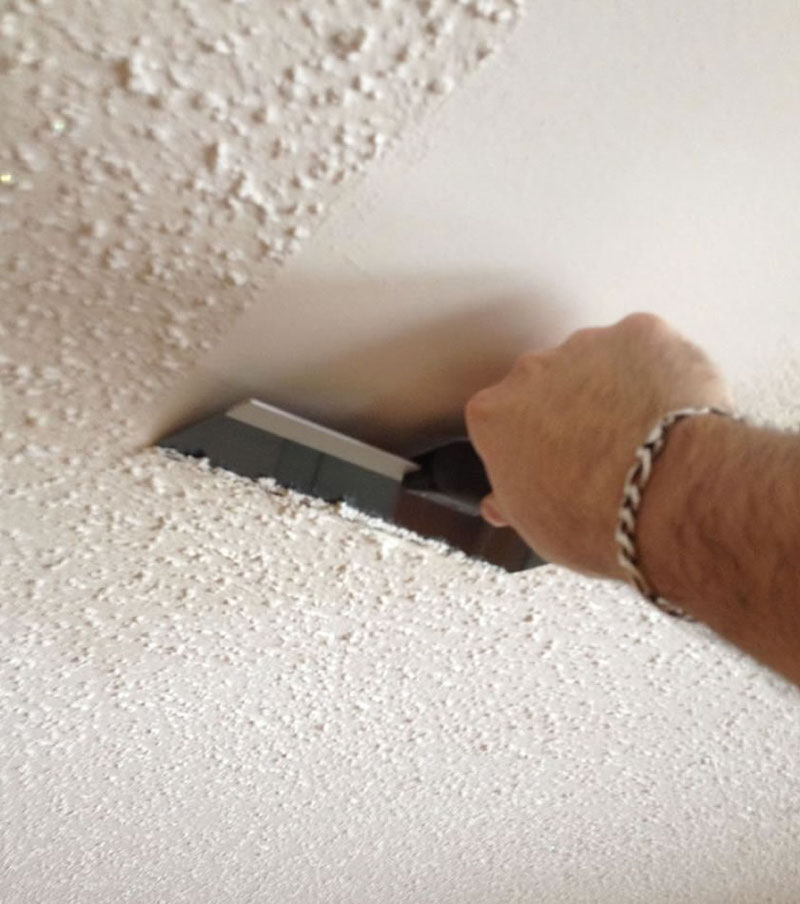 ceiling mistakes hand taking down popcorn ceiling