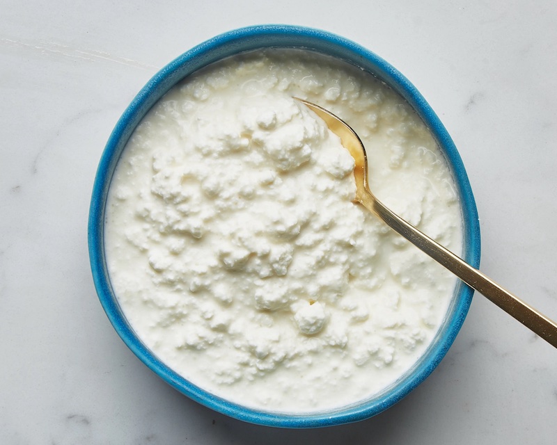 cottage cheese in a big bowl with spoon