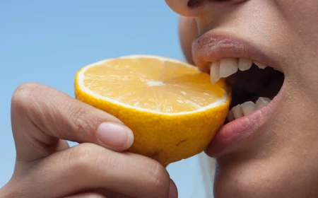 mouth eating a lemon