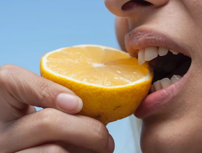 mouth eating a lemon