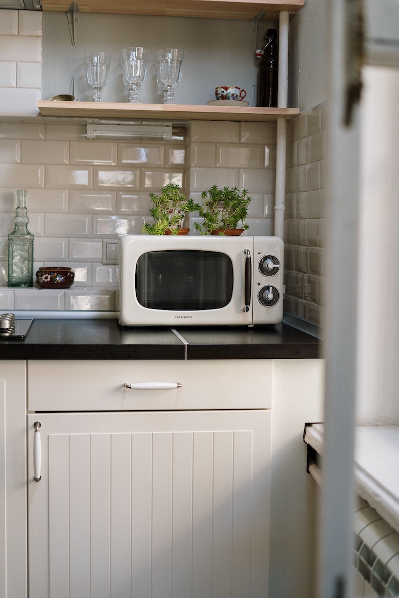white microwave on counter top