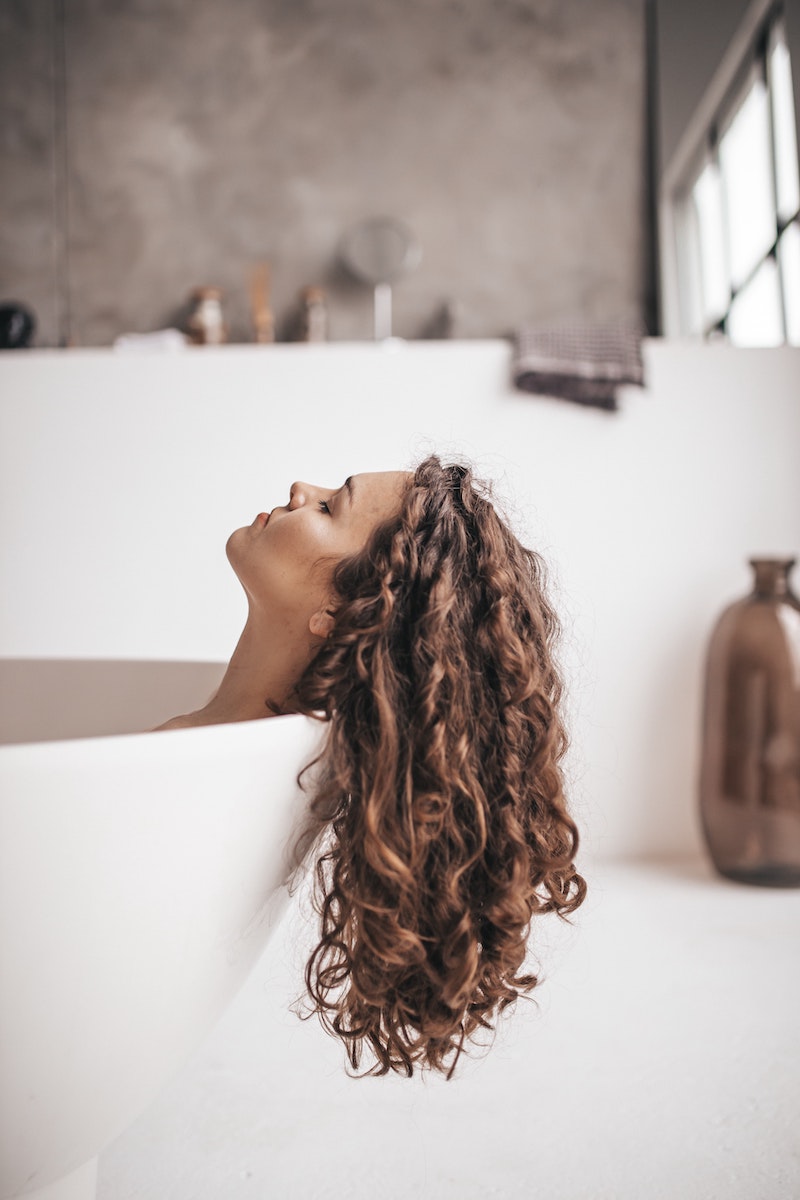 woman with curly hair hanging on the side