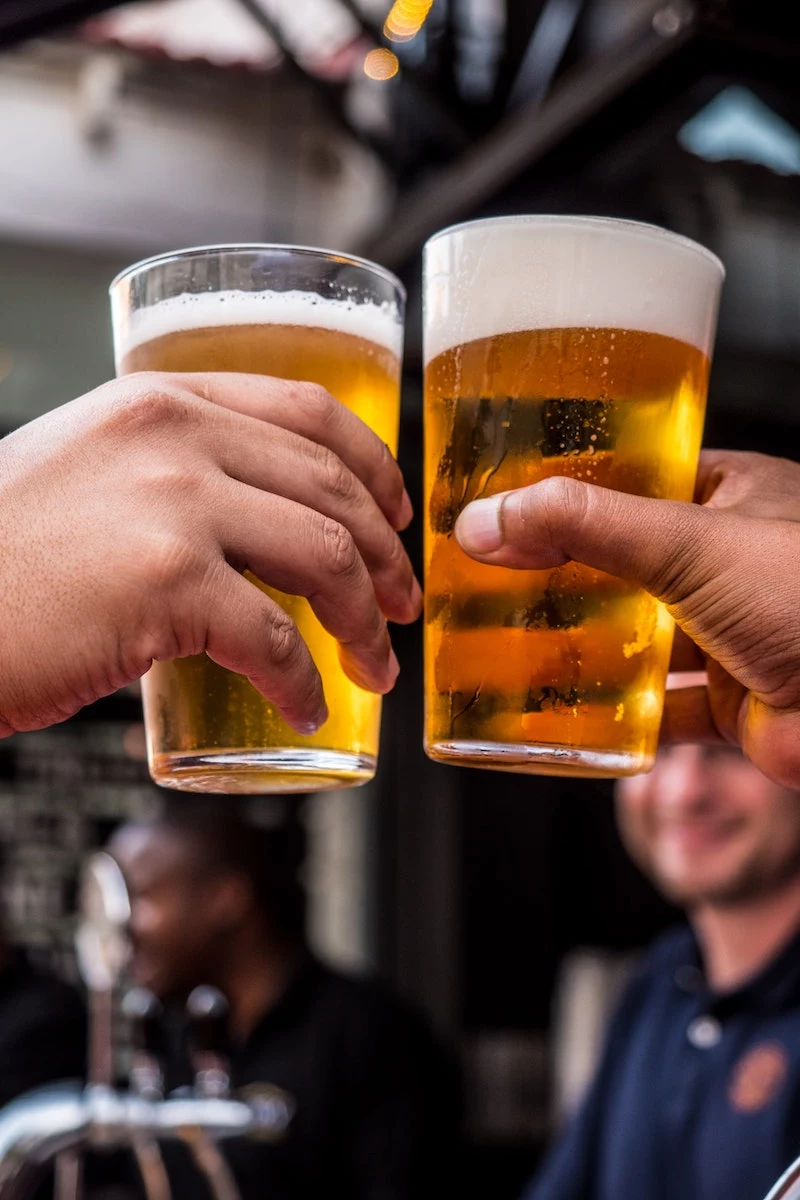 worst foods and drinks for your teeth two beers giving cheers