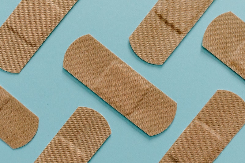 you're not getting enough protein band aids on blue background