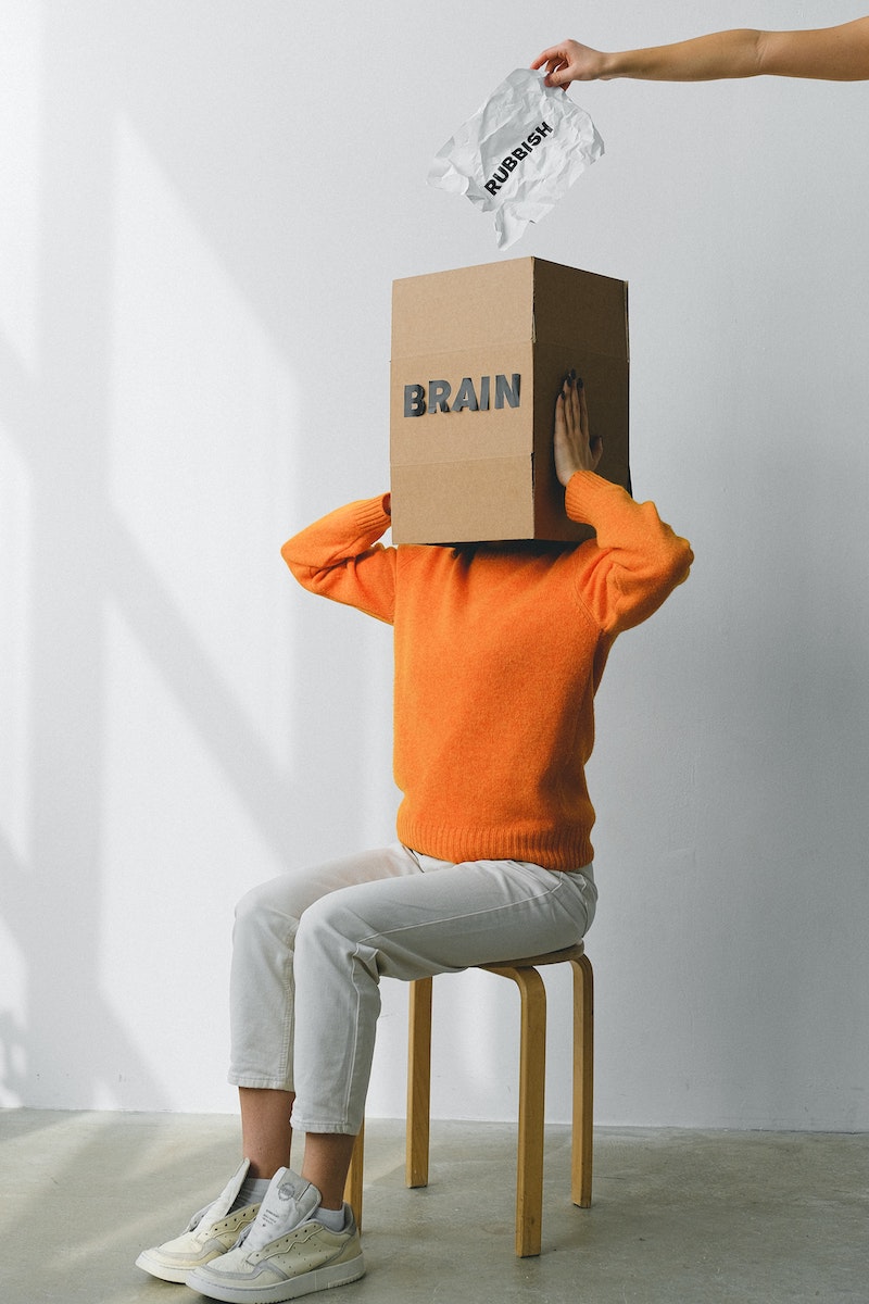 brain foods woman with box that says brain on head