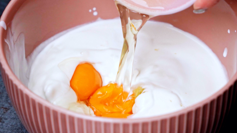 eggs in a pink bowl with cream