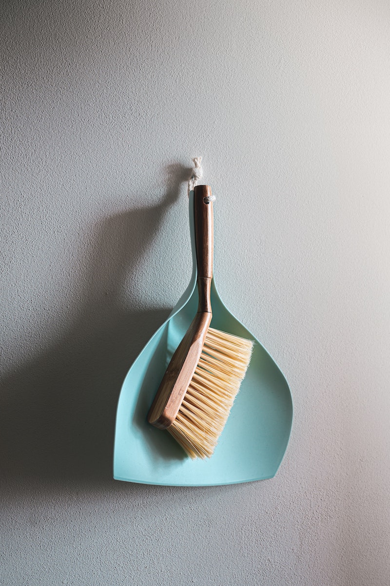 how to always have a clean home broom hanging on a wall