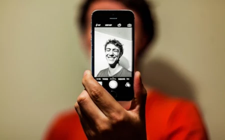man taking a selfie in black and white