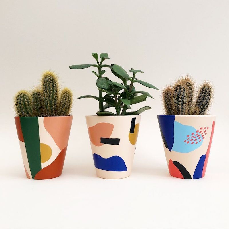 painted pots in shapes and different colors