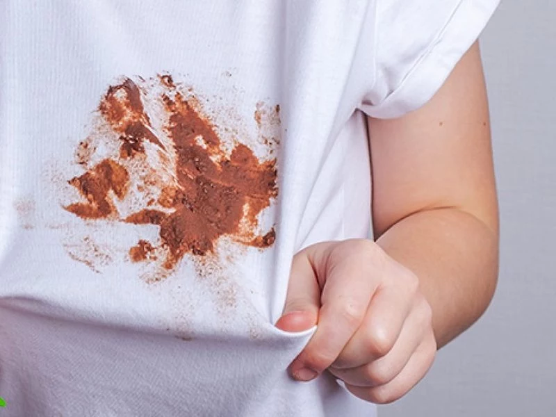 person with big stain on white shirt