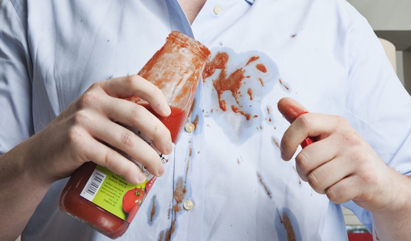 person with tomato sauce on their shirt