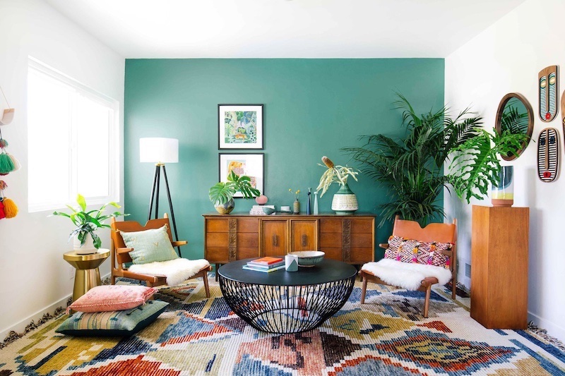 room with a green blue accent wall