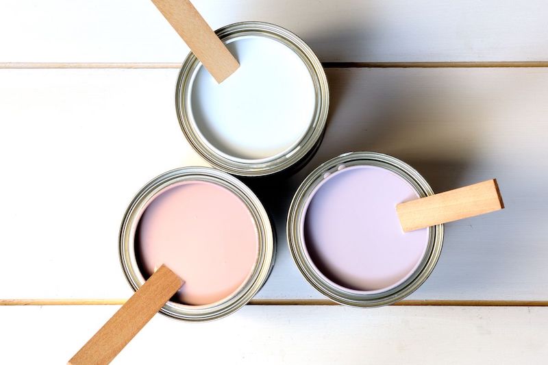 three types of paint cans open