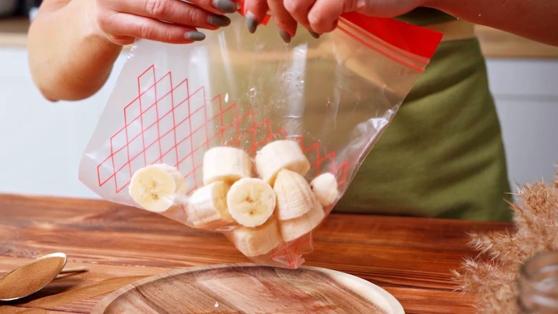 banana pieces into a ziplock bag