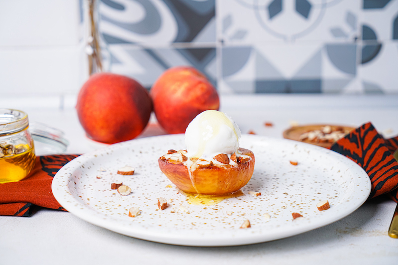 batch peaches in the air fryer with ice cream and almonds